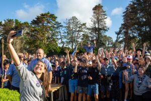 The Scouts Aotearoa National Commissioner takes a selfie with the attendees of the MoanaRua Zone Founder's Day Camp